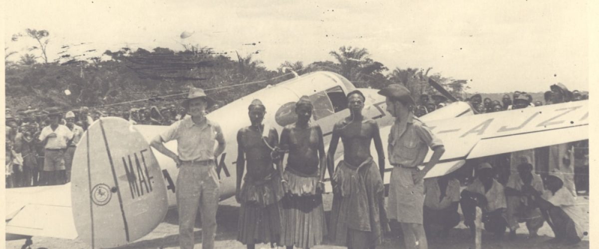 Reviewed by KHS 

Left: Jack Hemmings, pilot. Right: Stuart King, engineer and radio operator with African chiefs at Bulape, Central Congo. Aircraft: the Miles Gemini, named the 'Mildmay Pathfinder' used on the initial MAF survey of Central Africa in 1948The first part of the surveying of East and Central Africa included a stop at Bulape where mission doctor Mark Poole and his wife served. They had cleared a strip in their remote location in southern Congo and telegrammed to ask Stuart and Jack to visit. They had suffered sleeping sickness due to the long and frequent journeys they made overland through tsetse-fly areas. 3000 people, some walking 30 miles through the bush, came to see the plane across the weekend they were there. For full account see Hope has Wings, pages 58-62 (Chp5, Breaking New Ground).